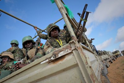 Ugandan soldiers serving with the African Union Mission in Somalia (AMISOM) prepare to deploy near the Somali capital of Mogadishu in an area that became home to a large refugee population (file photo).