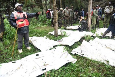 Rescue teams prepare bodies of FlySax plane crash victims for transportation from the Aberdares on June 7, 2018.