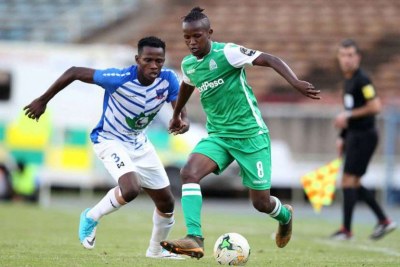 Gor Mahia midfielder Francis Kahata (right) shields the ball from Chidiedube Duru of Lobi Stars during a Caf Africa Champions League match in Nairobi on December 16, 2018.