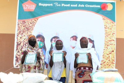 L-R: Participants: Aisha Danladi, Rahila Yakubu and Hauwa Ali during the presentation of fertilizers and herbicides by Value Seeds in partnership with Mastercard Foundation on its COVID-19 Recovery and Resilience programmed in Kano .