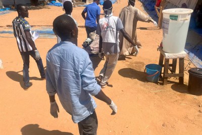 A patient is carried to a Médecins Sans Frontières treatment center in Chad for refugees from conflict in Sudan. 
