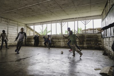 Children play football in an empty classroom at the UNICEF-supported Bulengo Primary School in the Bulengo displacement site, near Goma, North Kivu province in DR Congo, on 10 February 2025.